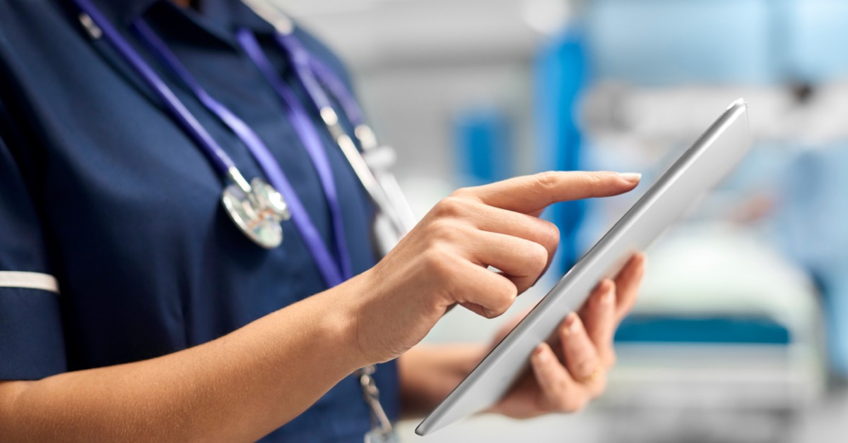 Image of medical personnel reviewing a note