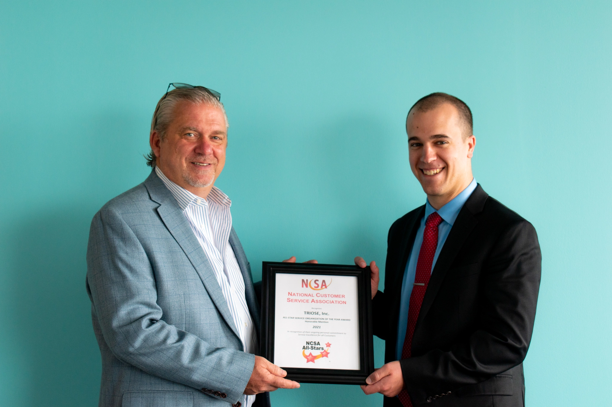 Gerry Romanelli, CCO of TRIOSE, receiving National Customer Service Association All-Star Award.